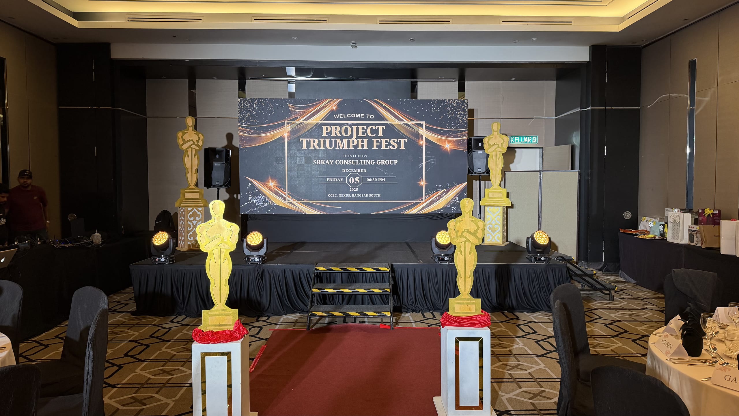 Oscars-themed award night with gold statues and a red carpet
